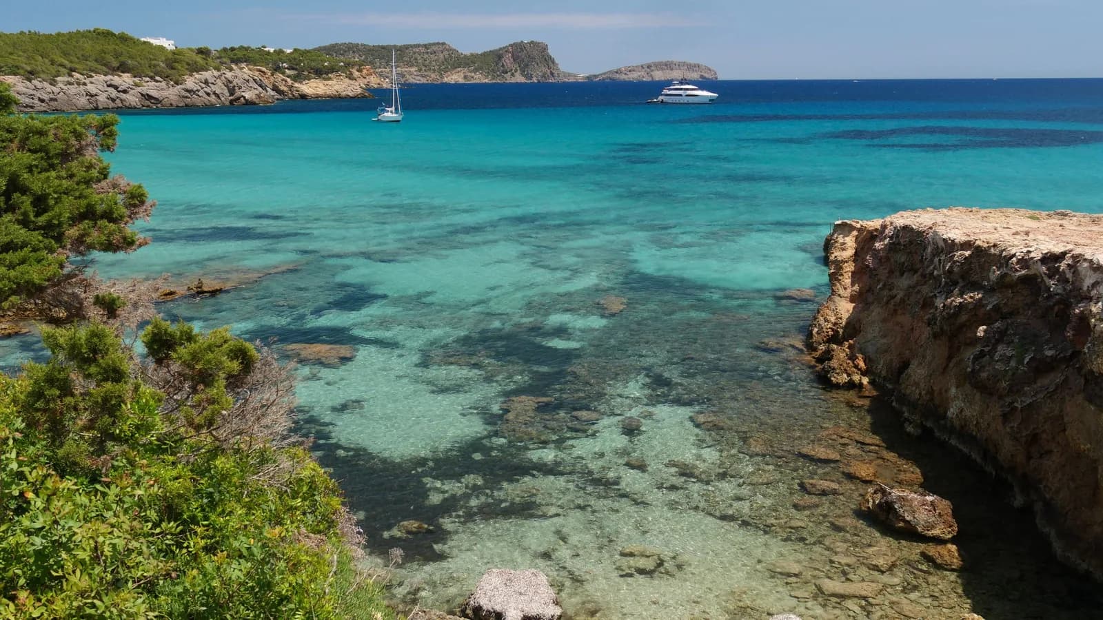 The clear water along the coast of Cala Nova