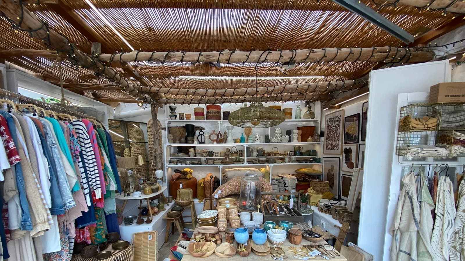 A shop filled with clothing and handmade homeware